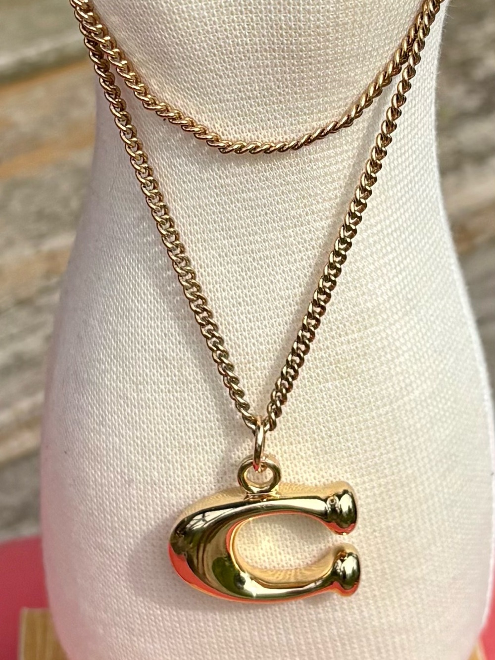 Coach Signature 3D "C" Charm. Polished Gold-Tone Brass Finish.